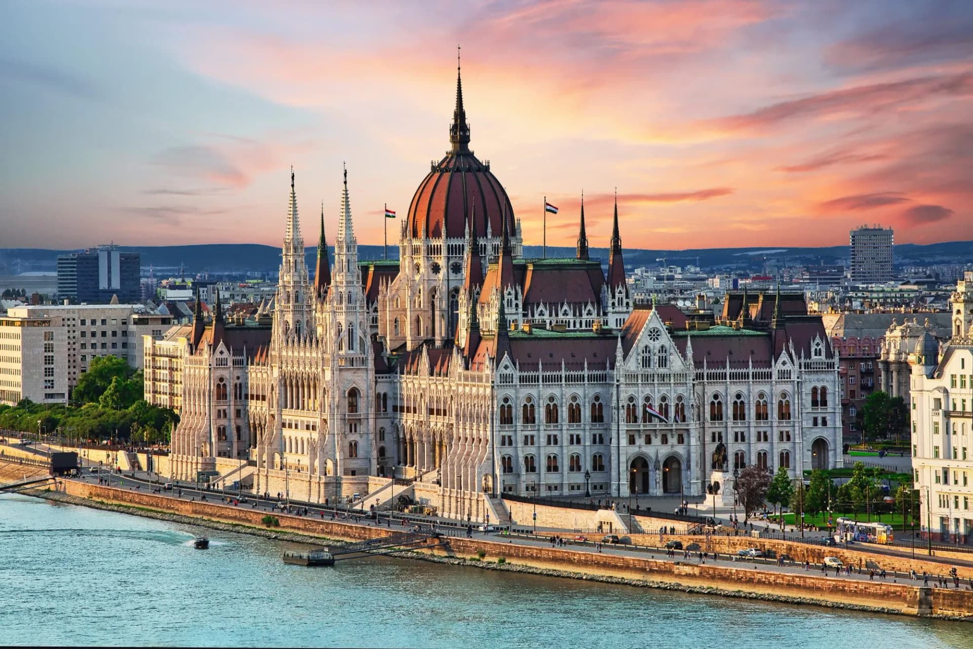 Hungarian Parliament Building on the Danube River at sunset in Budapest