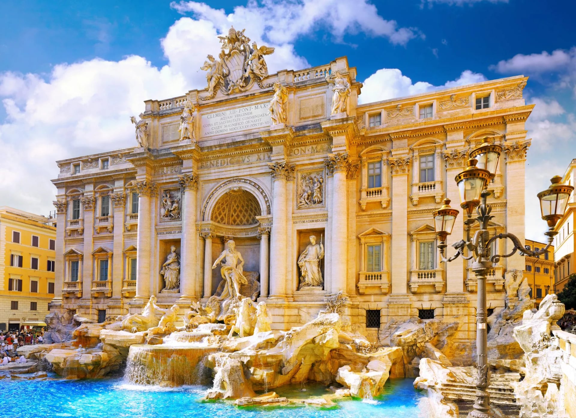 Trevi Fountain with bright blue water and ornate Baroque architecture in Rome, Italy