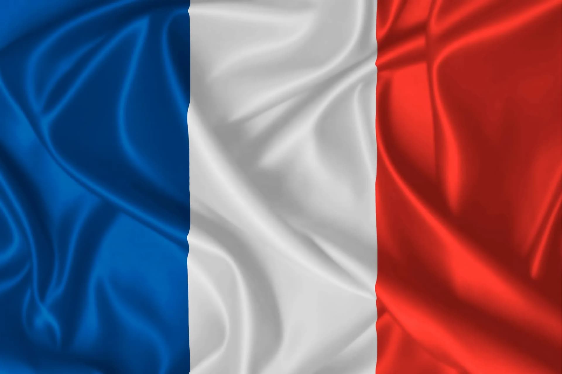 France national flag blowing in the wind on fabric texture