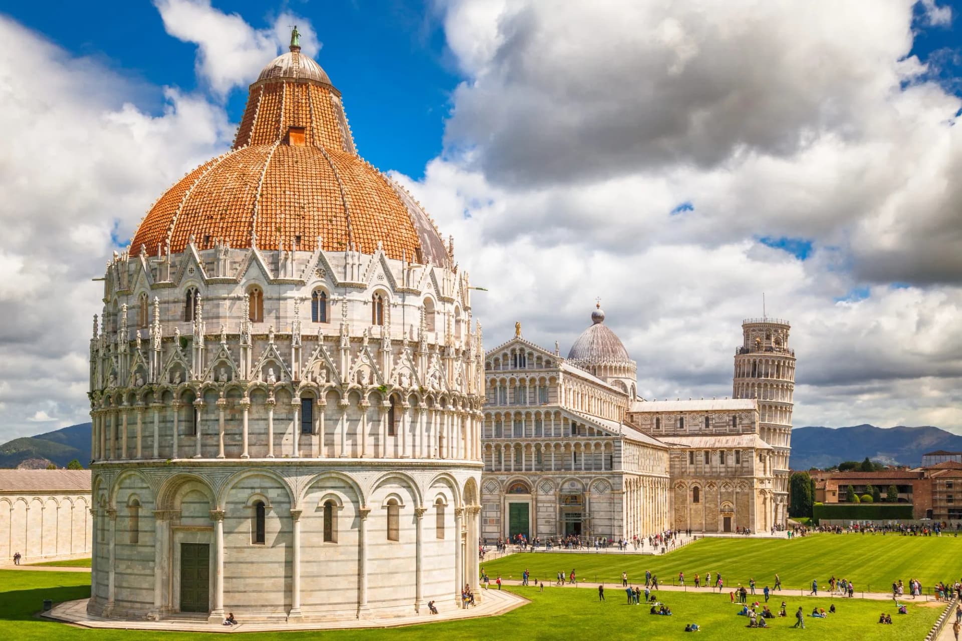 Pisa Baptistery, Cathedral, and Leaning Tower on sunny day in Piazza dei Miracoli, Tuscany, Italy.