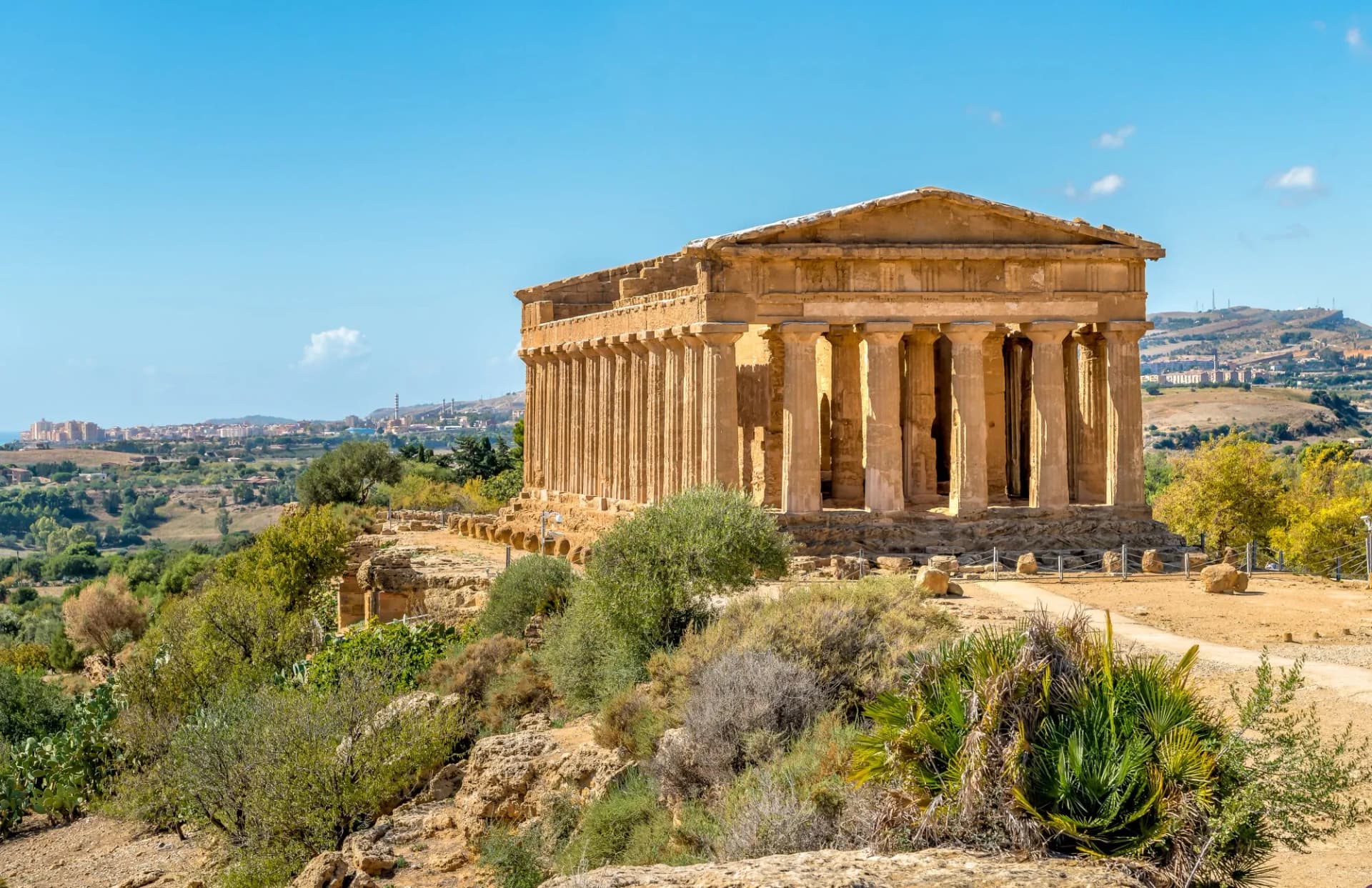 Temple of Concordia in the Valley of the Temples, Agrigento, Sicily, Italy under blue sky.