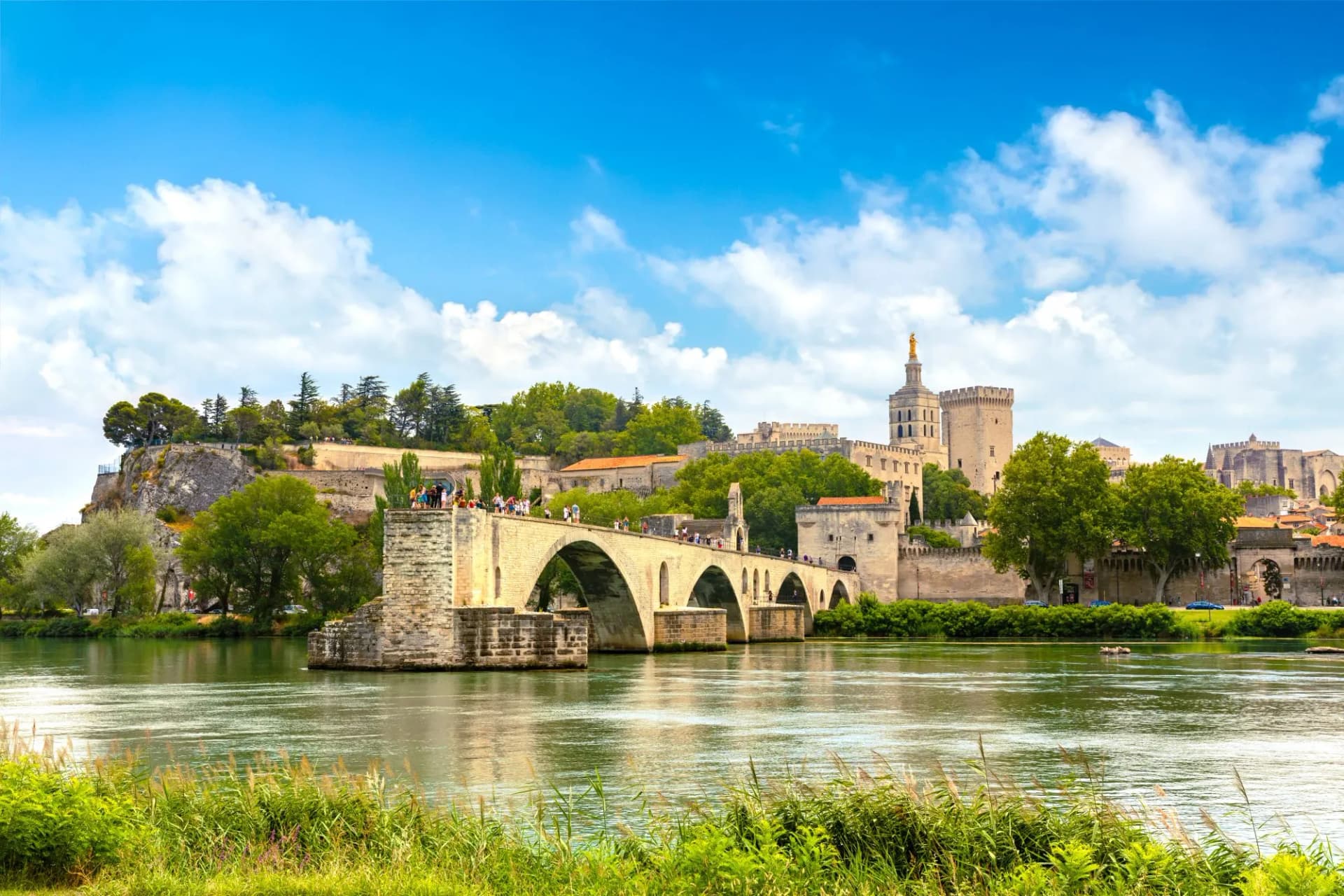 Saint-Bénézet Bridge in Avignon, France, over the Rhône River on a summer day.