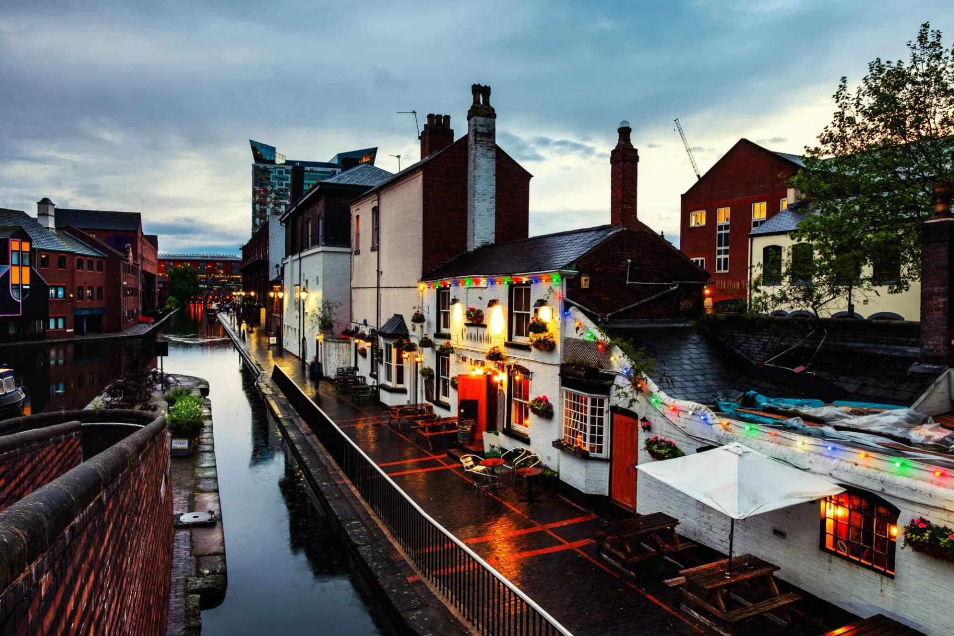 Canal embankments illuminated in the evening at a famous Birmingham canal in the UK.